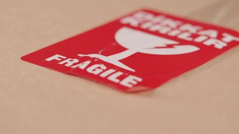A close-up view shows a package with a fragile label on it Stock Footage 329657680