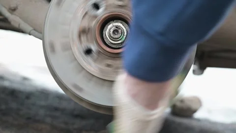 A close-up view shows the repair process of mechanical components with a focus Stockbeeldmateriaal 337550737