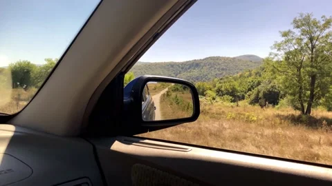 Close-Up View Of Side Mirror From Vehicle On Mountain Road.Car Side Mirror View. Stock Footage 149355449