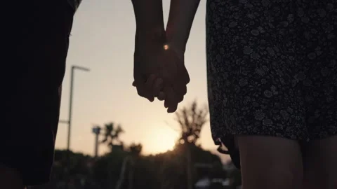 Close up view of silhouette of hands joining together with sunset on the Stock Footage 204967000