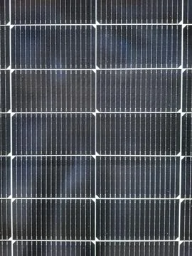 Close up view of silicon solar cells with metal grid lines promoting altern.. Stock Photos