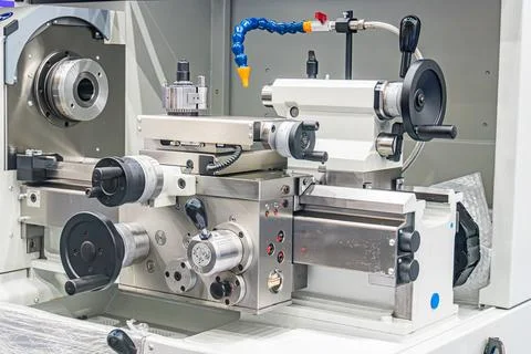 Close-up view of a silver CNC milling machine, with visible mechanical compon Stock Photos