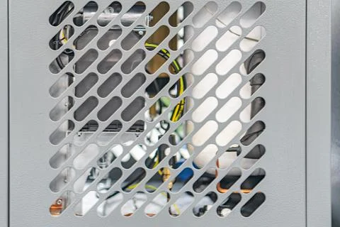 Close-up view of a silver honeycomblattice structured metal object with depth Stock Photos