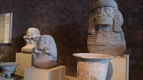 Close View of Skeletal Stone Statue and Small Figures, Mexico 8K Video stock 340369837
