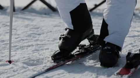 Close-up view of Skier Stepping into Ski Bindings on the Mountain. Stock Footage 147093187
