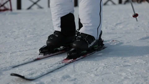 Close-up view of Skier Stepping into Ski Bindings on the Mountain. Stock Footage 147094447
