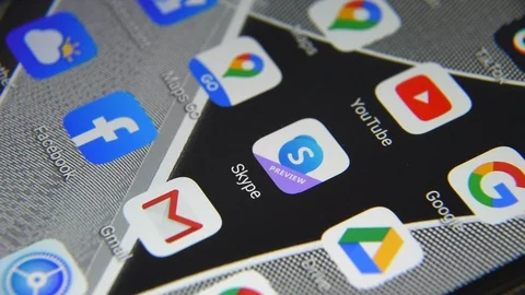 Close-up view of Skype icon app on an Android smartphone, including other icons. Stock Footage 127747997