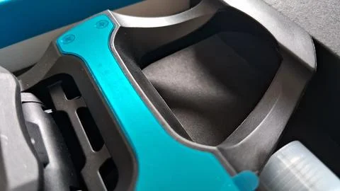 Close up view of a sleek black and teal bicycle pedal Stock Photos