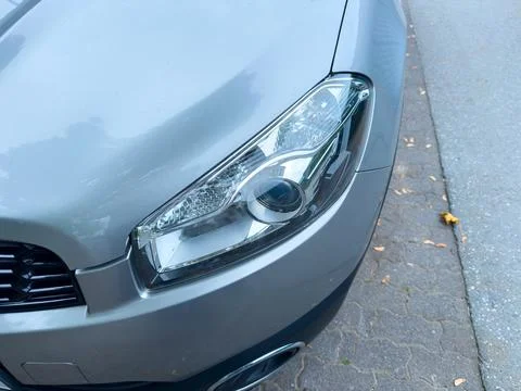 Close-up view of a sleek car headlight showcasing modern design elements am.. 스톡 사진