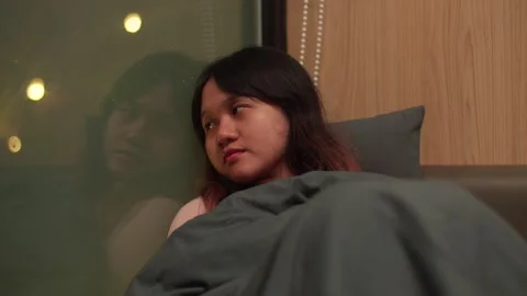 Close-up view, sleepy morning, comfortable warm blankets, young girl Vidéo 304101780