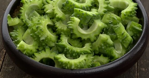 Close up view of sliced bitter gourd in bowl. Stock Footage 284557625