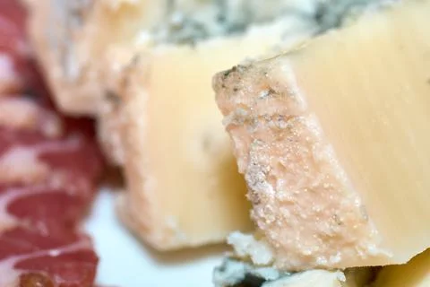 Close-up view of sliced blue cheese and cured meat on a plate Stock Photos