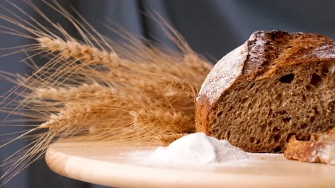 Close Up View of Sliced Bread on Wooden Cutting Board. Sourdough Bread Sliced on Stock Footage 202739568