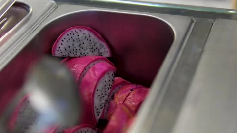 Close-up view of sliced dragon fruit pieces Stockbeeldmateriaal 316063249