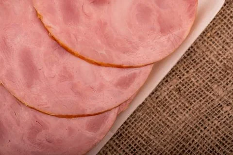 A close-up view of the sliced ham from above. Stock Photos