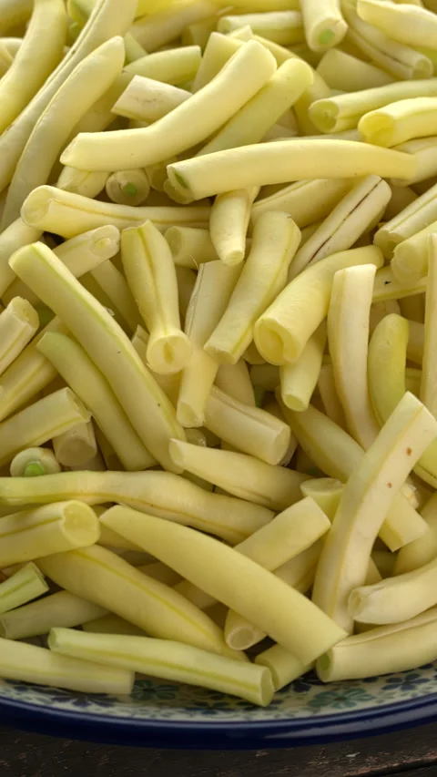Close up view of sliced yellow string beans. Vertical video. Stock Footage 283138793
