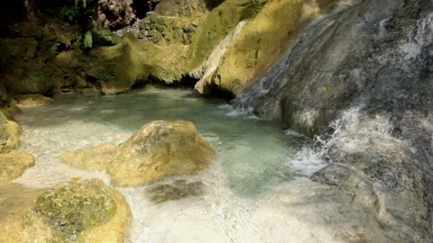 Close-up view of a small flowing limestone waterfall Stock Footage 321321519