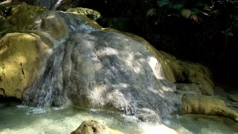 Close-up view of a small flowing limestone waterfall Stock Footage 321321542