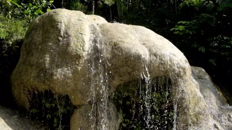 Close-up view of a small flowing limestone waterfall Stock Footage 321321616