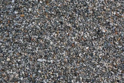 Close-up view of small gray pebbles and stones texture Stock Photos