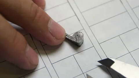 Close view small lithium plates measured with modern meter 스톡 동영상 94137751