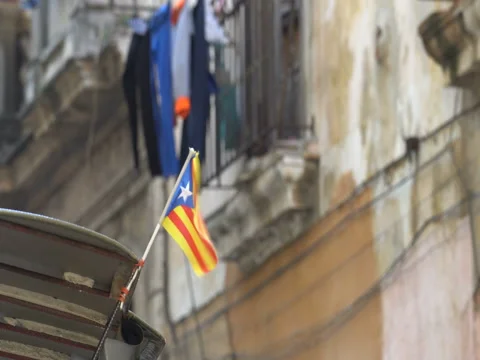 Close-up view of small Puerto Rico flag which flutters on wind at building's Stock Footage 69784268
