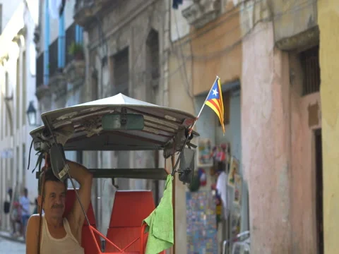 Close-up view of small Puerto Rico flag which flutters on wind at taxi's roof in Stock-Footage 69784297