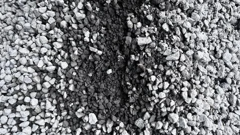 Close up view of small rocks and gravel forming a rough textured surface with Foto stock