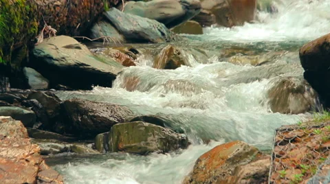 Close-up view of a small waterfalls of the tropical mountain river Stock Footage 65730468