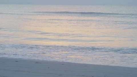 Close-up view of small waves on the sea in the morning or evening reflecting the Stock Footage 277432783