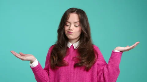 Close-up view of smiling, cheerful young woman looking at camera Stock Footage 229234038