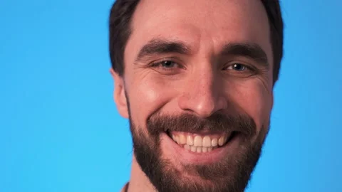 The close up view on smiling man face. slow motion Video stock 150723994