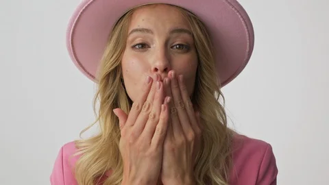 Close up view of smiling young blonde woman blowing a kiss with two hands Stock Footage 116036188