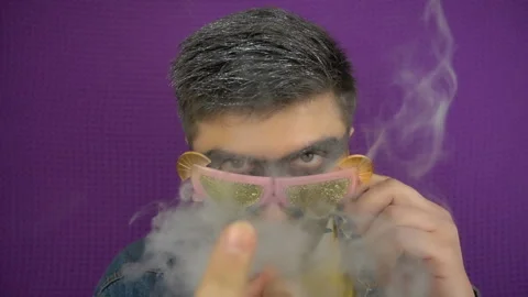 Close up view of smoking stylish man in slow motion. Party concept. Stock Footage 100549790