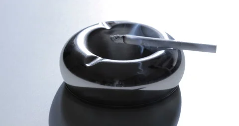 Close up view of Smoldering Cigarette in Ashtray Stock Footage 128893027
