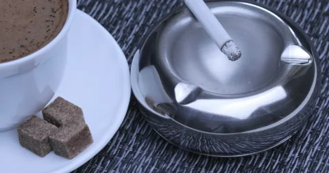 Close up view of Smoldering Cigarette in Ashtray Stock Footage 129962003