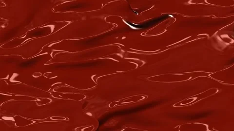 A Close-Up View of Smooth, Reflective Red Fluid Surface Showcasing Unique Stock Footage 316741818
