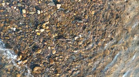 Close up view of smooth round pebble stones on the beach. Illustration
