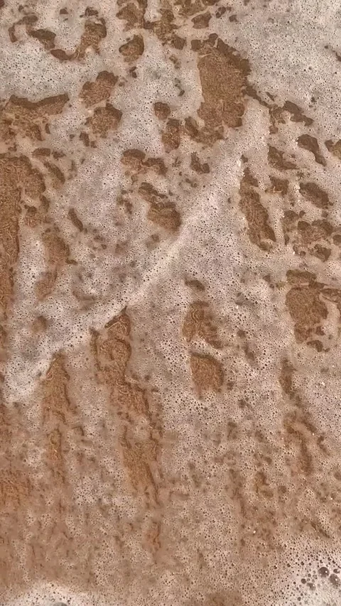 A close-up view of a smooth, sandy beach surface, highlighting the intricate Video stock 330096920