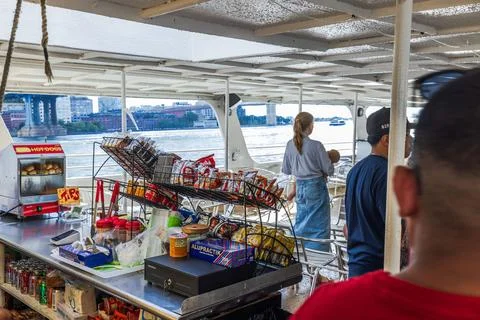 Close up view of snack bar with passengers aboard sightseeing boat Stock Photos