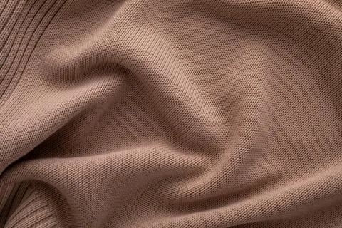 A close-up view of soft brown knitted fabric displayed smoothly across a flat Foto stock