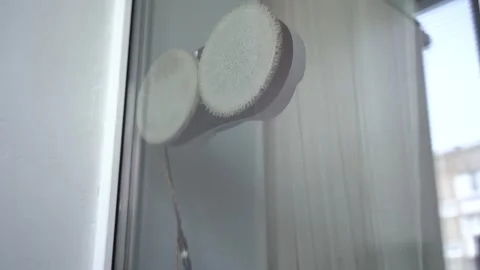 A Close-Up View of Soft Circular Objects Peeking Through a Glass Window, with Stock Footage 333514347