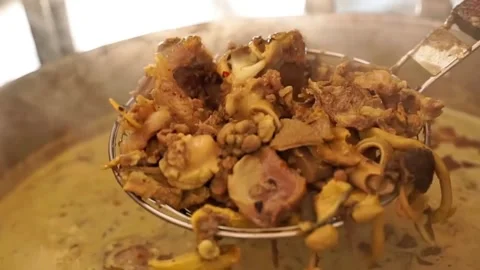 Close up view of soft goat meat soto tongseng soup in a large banner Stock Footage 300620951