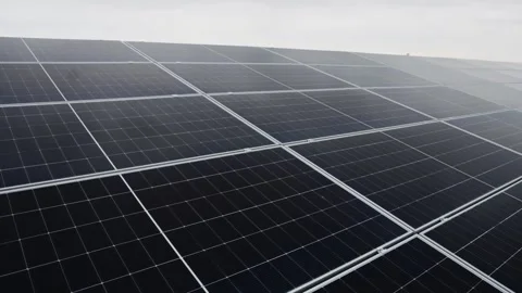 Close view of a solar panel array with bright sunlight reflection. Vídeo Stock 345610959