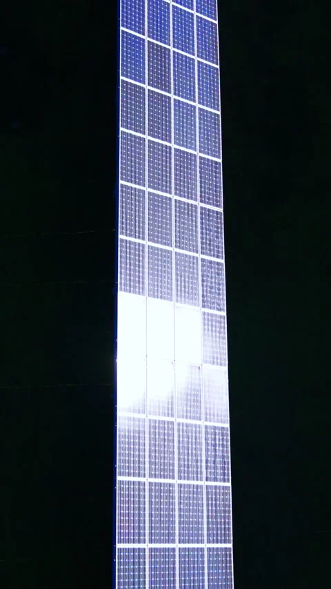Close view of solar panel column reflecting bright sunlight Vertical video. 스톡 동영상 338008068