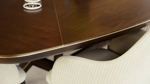 Close up view on solid surface of wooden table surrounded with cozy chairs Stock Footage 263674586