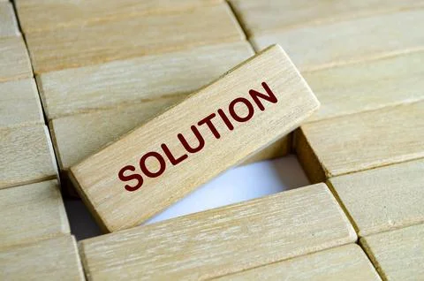 Close up view of solution text on wooden block representing problem solving.. Stock Photos