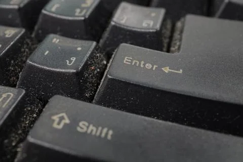 A close view of some keys on a dirty, black keyboard. Stock Photos