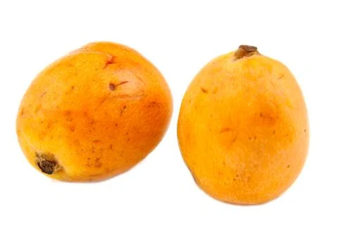 Close up view of some loquat fruit on a white background Stock Photos