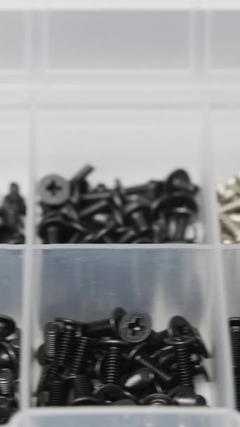 Close-up view of sorted miniature screws for electronics, computer repair and Stock Footage 346875190